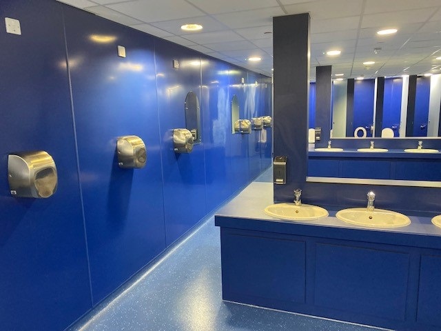 Blue PVC wall lining with fittings fitted