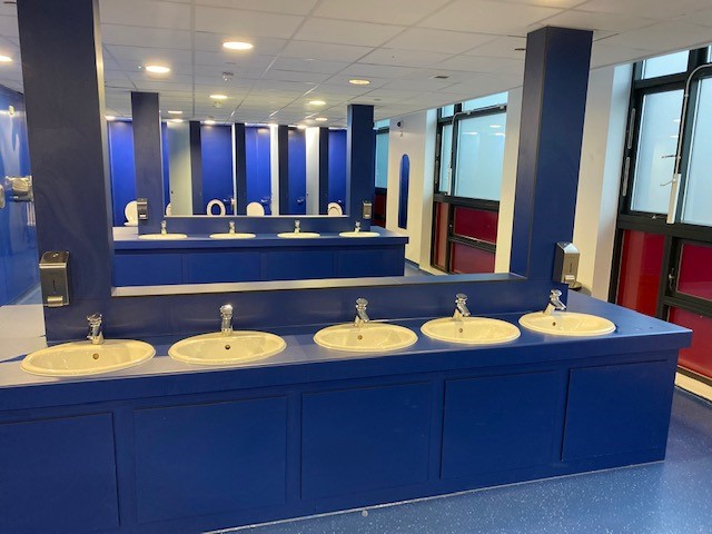 Completed WC refit with blue hygienic PVC wall claddingHardware